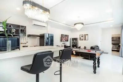 Luxurious living room with pool table and modern decor