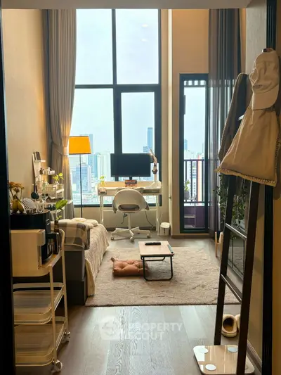 Modern studio apartment with city view and stylish decor