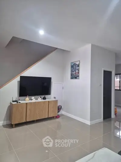 Modern living room with sleek TV setup and stylish decor