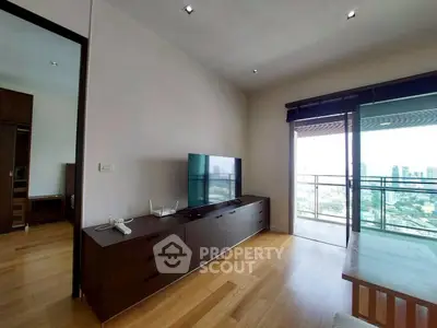 Modern living room with city view and sleek furniture in high-rise apartment