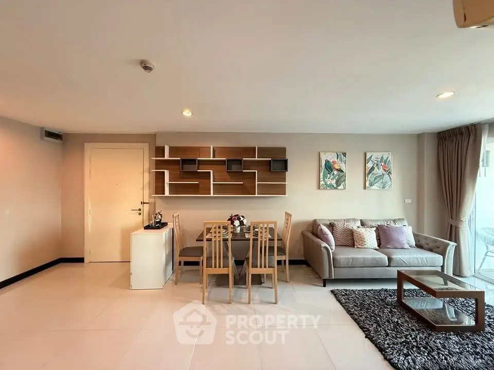 Spacious modern living room with stylish decor and ample natural light