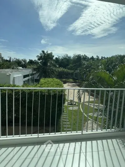 Stunning balcony view overlooking lush greenery and modern architecture