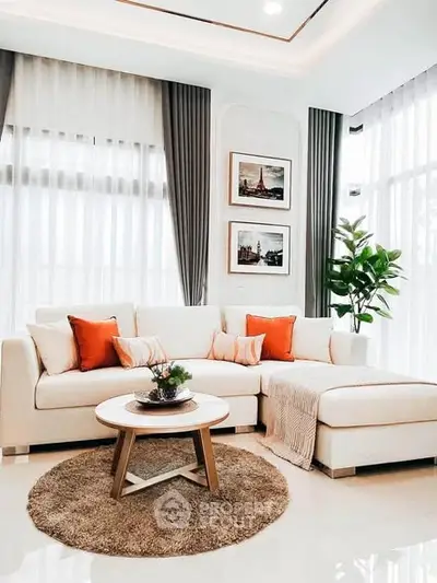 Elegant living room with modern decor, featuring a cozy sectional sofa and stylish accents.