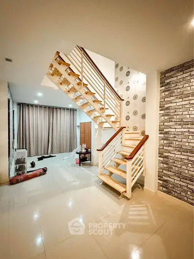 Modern interior with stylish staircase and spacious living area