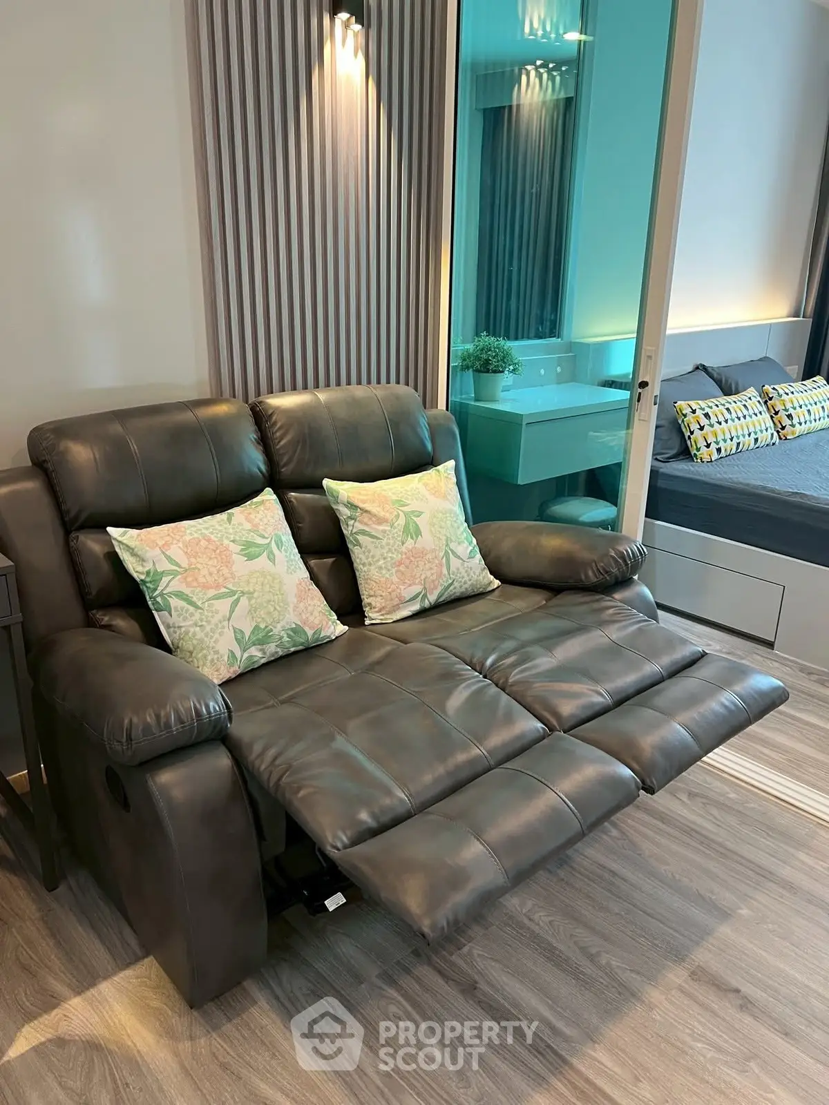 Modern living room with reclining leather sofa and stylish decor