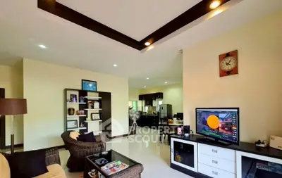 Spacious living room with modern decor and open kitchen layout