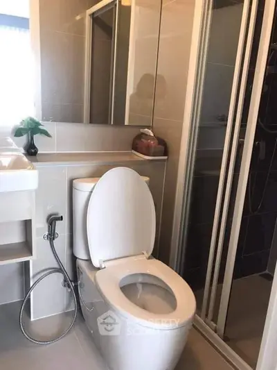 Modern bathroom with sleek fixtures and shower enclosure