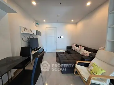 Modern living room with stylish furniture and sleek design, perfect for relaxation and entertainment.