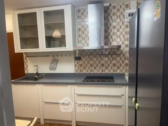 Modern kitchen with sleek cabinetry and stainless steel appliances