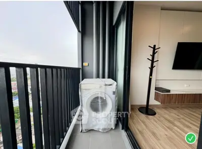 Modern balcony with washing machine and city view, perfect for urban living.