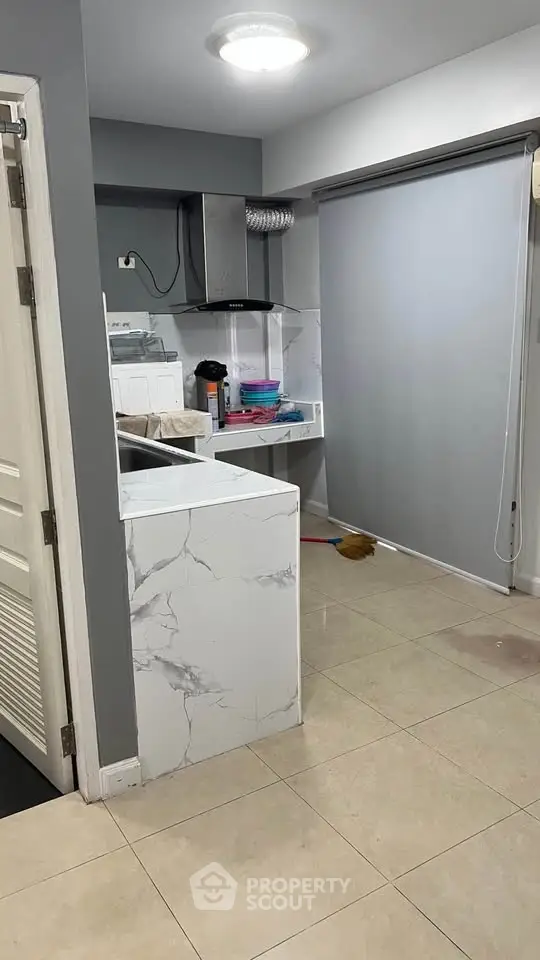 Modern kitchen with marble countertops and sleek design