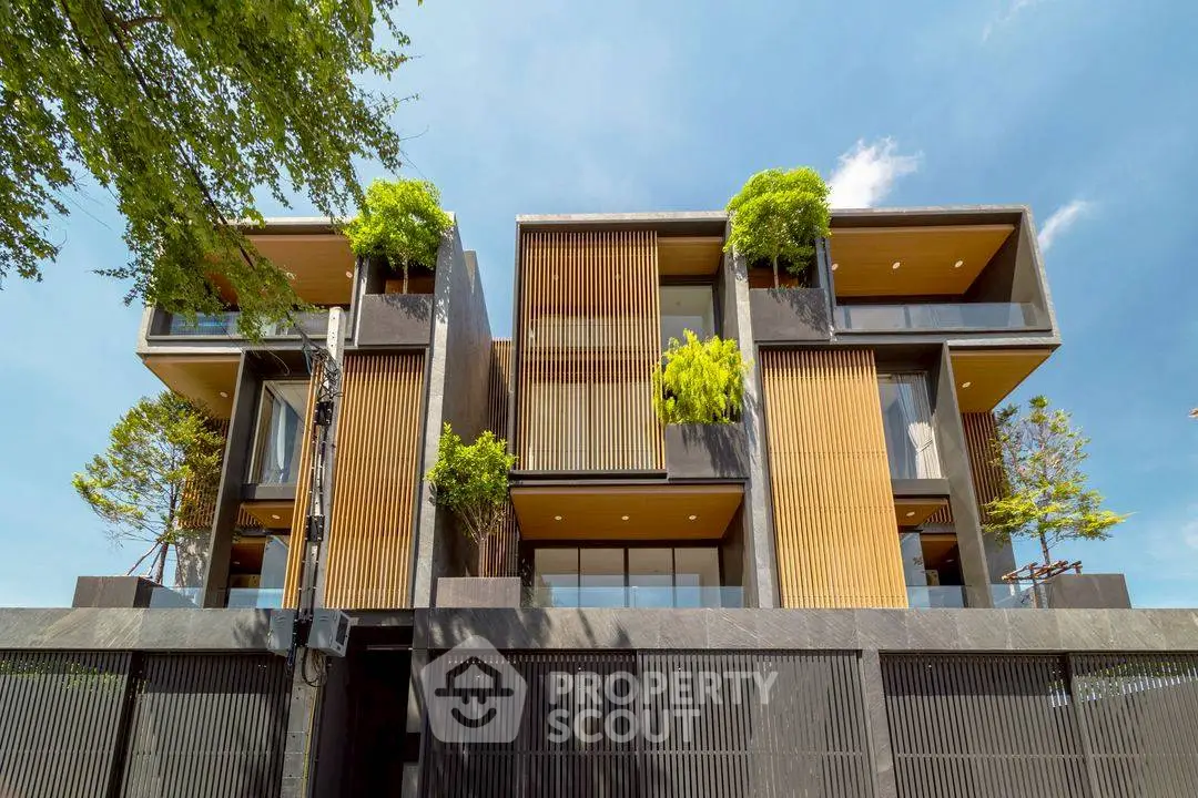 Modern architectural masterpiece with lush greenery and sleek design