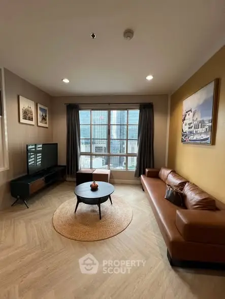 Stylish living room with modern decor, leather sofa, and city view window in urban apartment.