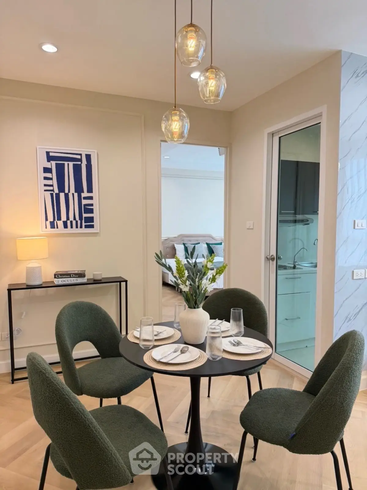 Stylish dining area with modern decor and cozy seating in a contemporary apartment.