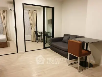 Modern apartment interior with cozy living area and study space