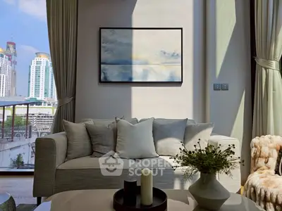 Luxurious living room with modern decor and stunning city view, featuring elegant sofa and artistic wall painting.