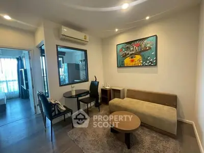 Modern living room with stylish decor and cozy seating area in a contemporary apartment.