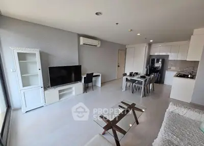 Spacious modern living room with open kitchen and stylish furniture