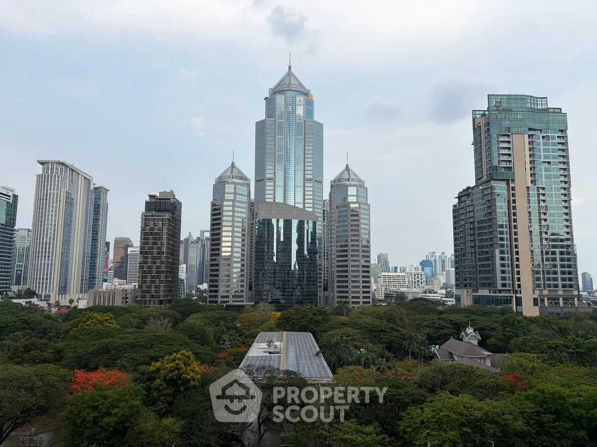 Stunning cityscape view with modern skyscrapers and lush greenery, perfect for urban living enthusiasts.