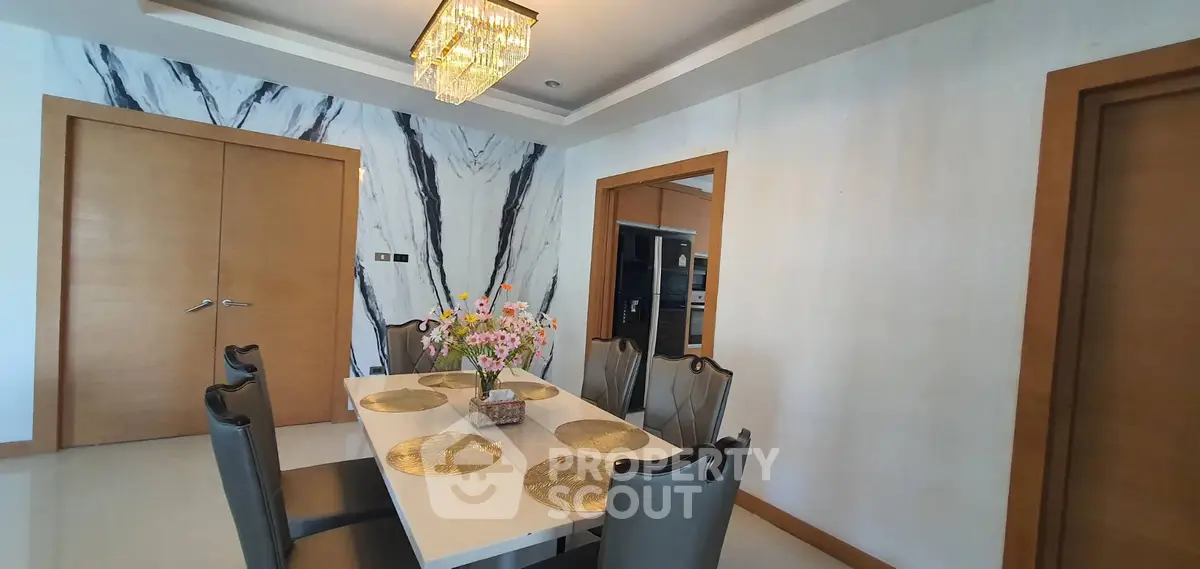 Elegant dining area with modern decor and stylish chandelier