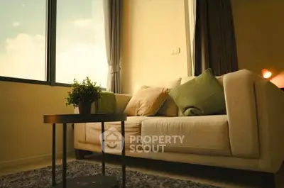 Cozy living room with modern sofa and large window view