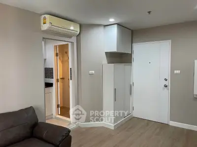 Modern apartment interior with air conditioning and compact bathroom entrance