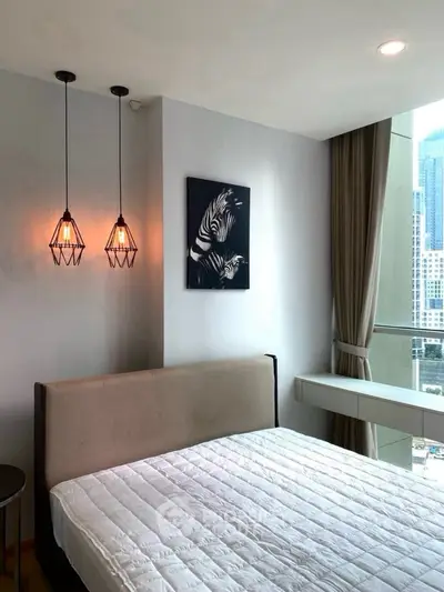 Modern bedroom with city view and stylish lighting fixtures