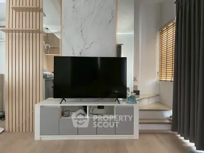 Modern living room with sleek TV stand and stylish decor