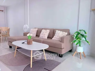 Modern living room with stylish beige sofa and chic decor