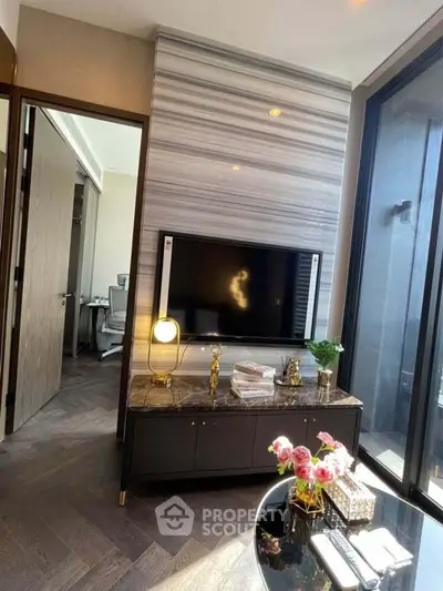 Luxurious living room with modern decor and large windows for natural light.