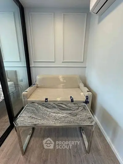 Modern compact living space with stylish furniture and air conditioning