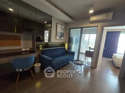 Modern living room with blue sofa and stylish decor in a contemporary apartment