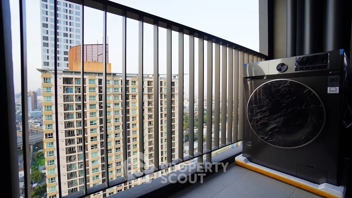 Modern balcony with city view and washing machine, perfect for urban living.