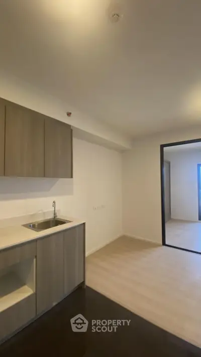 Modern open-layout kitchen with sleek cabinetry and spacious design.