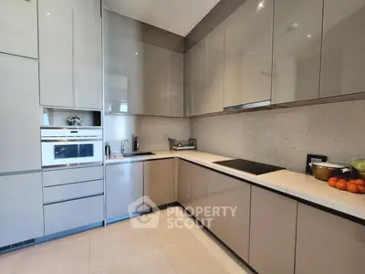 Modern kitchen with sleek cabinetry and built-in appliances