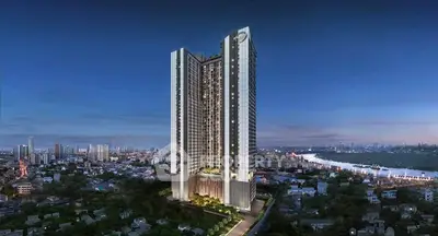 Stunning high-rise building with panoramic city and river views at dusk.