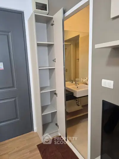 Modern apartment with sleek bathroom and storage solutions