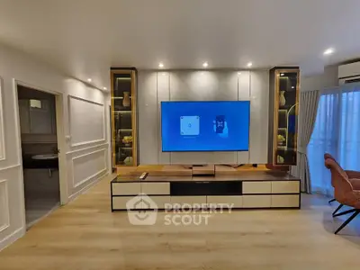 Modern living room with sleek TV setup and elegant lighting