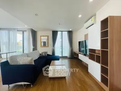 Spacious modern living room with elegant decor and natural light