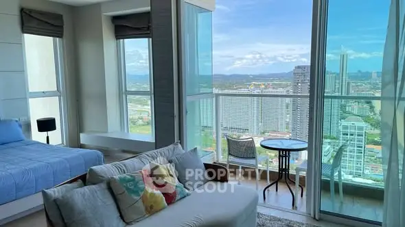 Luxurious high-rise apartment with stunning city view and cozy living area.