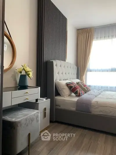 Luxurious bedroom with elegant decor and natural light