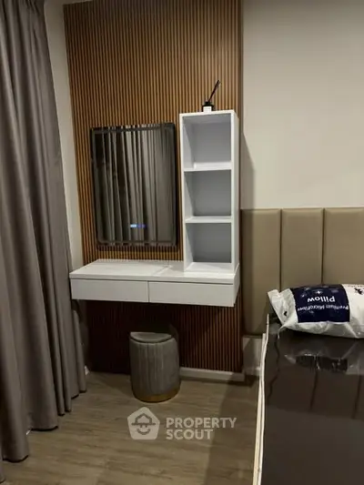 Modern bedroom with stylish vanity and elegant decor