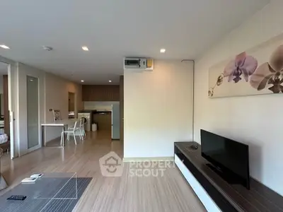 Modern living room with open layout and stylish decor in a contemporary apartment.