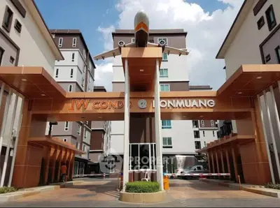 Modern condo entrance with unique airplane design at JW Condo Donmuang.