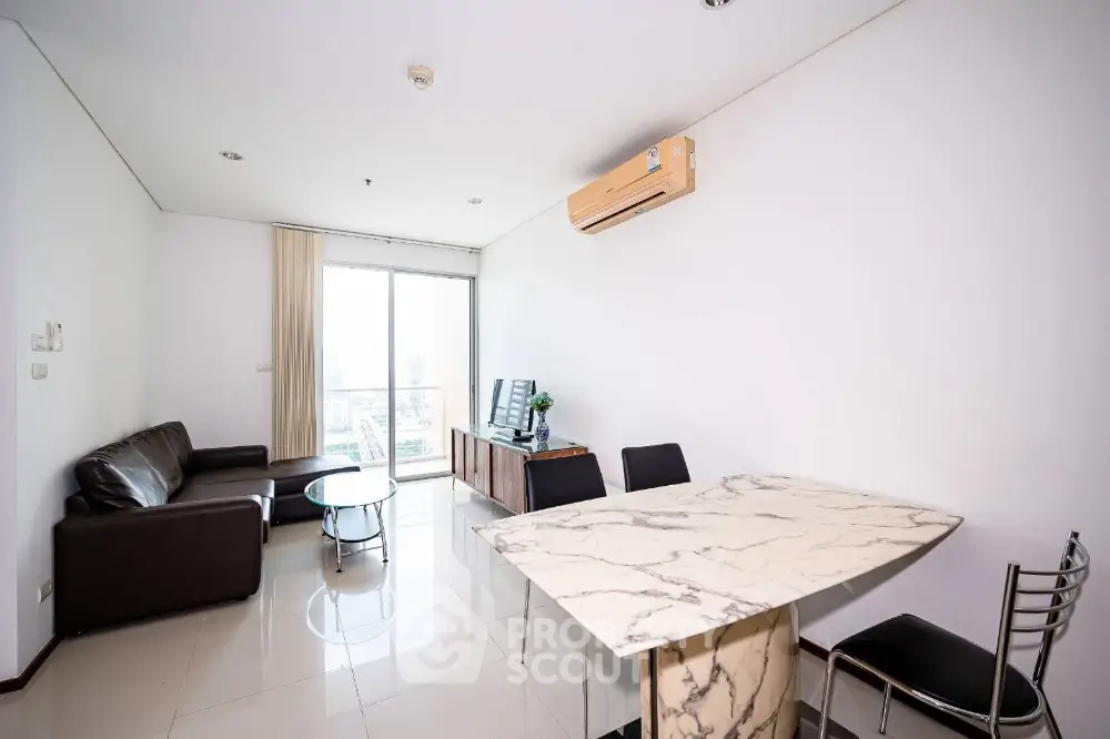 Modern living room with marble dining table and city view balcony