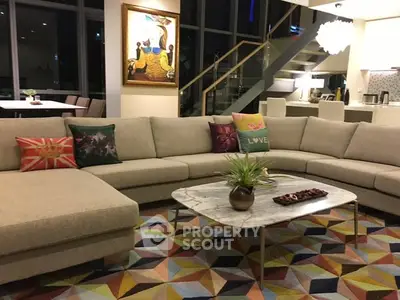 Luxurious modern living room with stylish decor and spacious seating area.