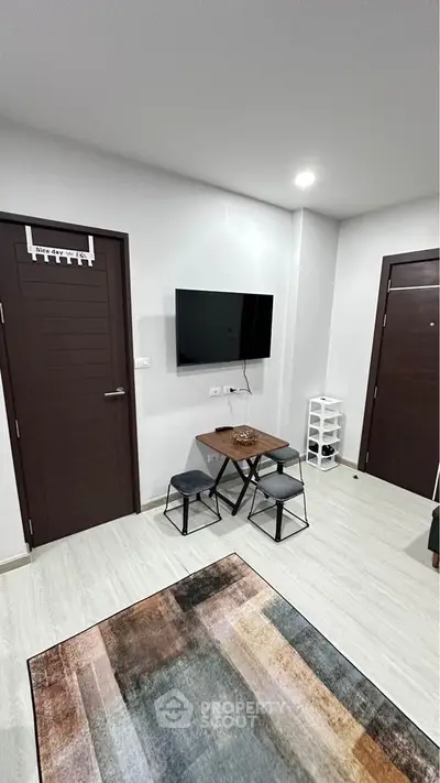Modern living room with wall-mounted TV and stylish decor