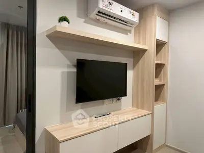 Modern living room with sleek TV unit and air conditioning