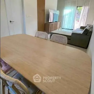 Modern living room with dining table and cozy seating area