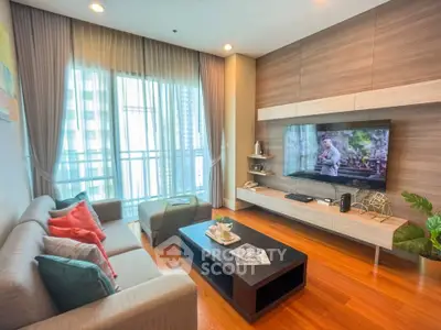 Modern living room with stylish decor and large window view in urban apartment